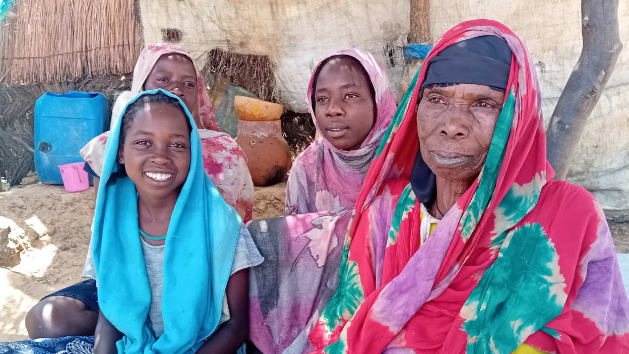 Naima with her daughters at their shelter in Zabout Refugee Camp
